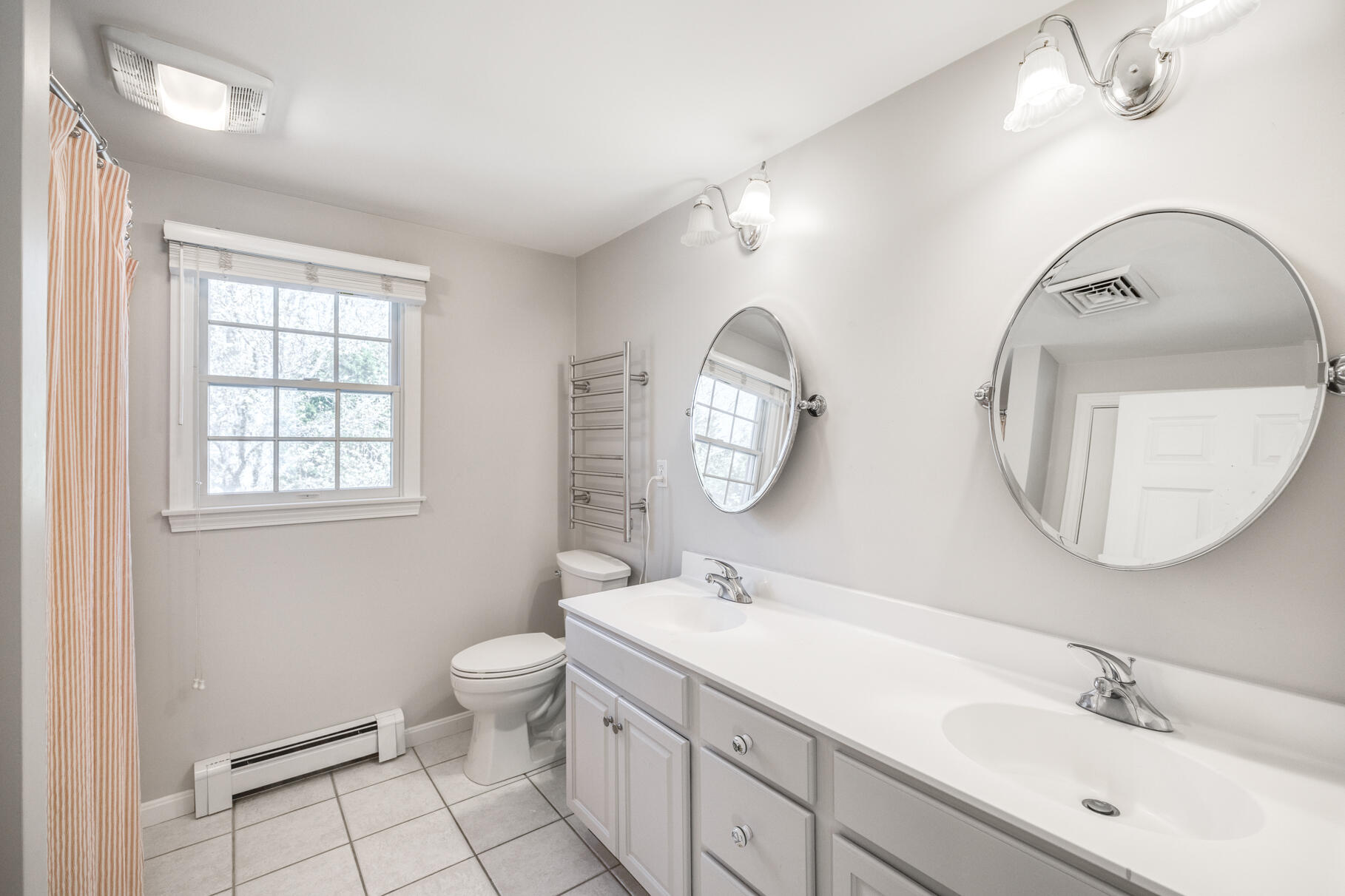 25 Blanid Road Osterville, MA 02655 - Photo 21 of 27 a bathroom with a double vanity sink mirror and toilet