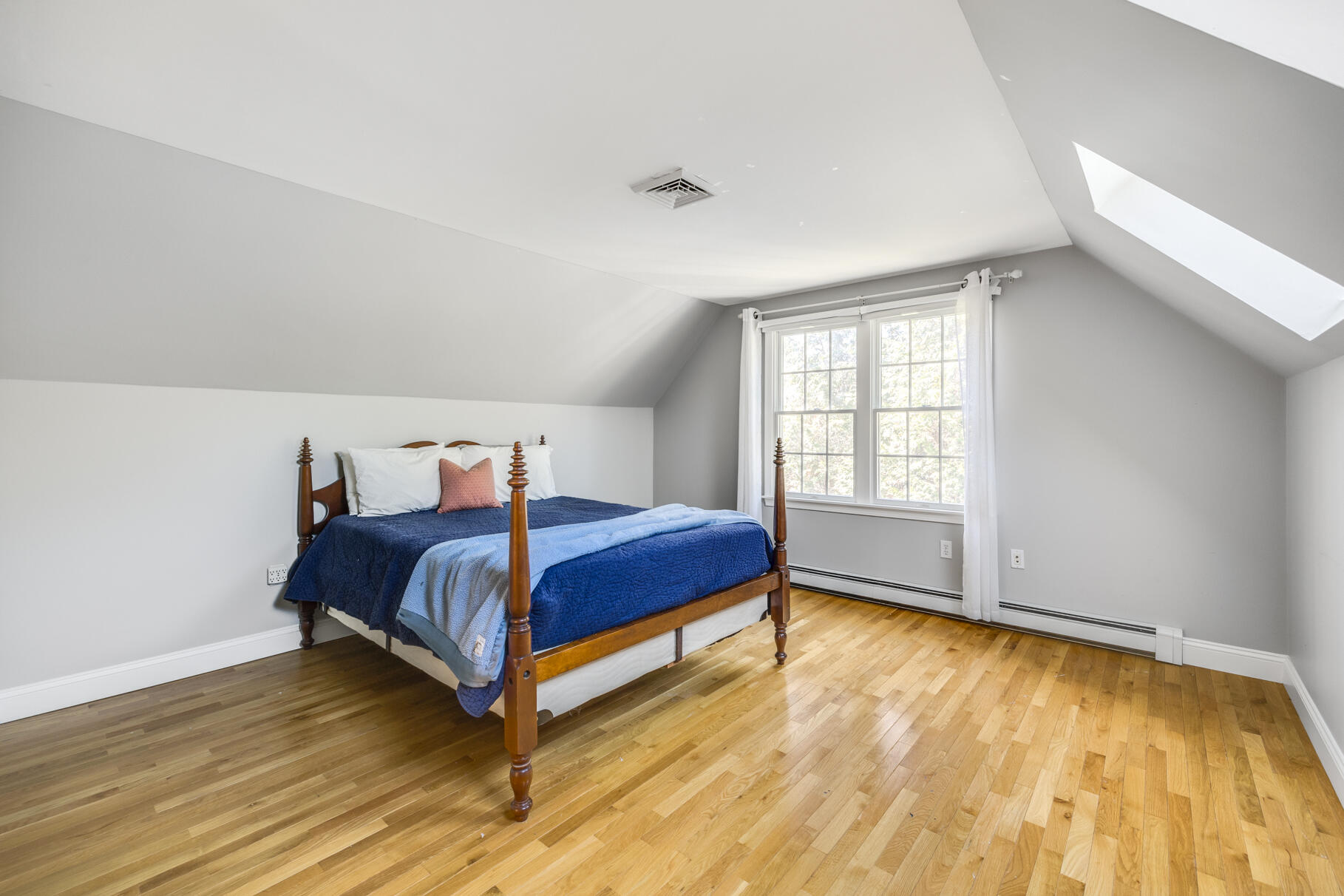 25 Blanid Road Osterville, MA 02655 - Photo 22 of 27 a bedroom with a bed and wooden floor