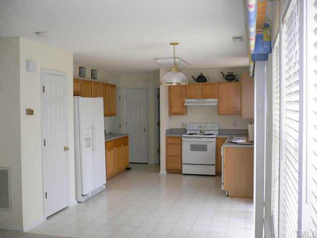 4445 Whatley Lane Raleigh, NC 27604 - Photo 3 of 9 Bright open, newly painted kitchen