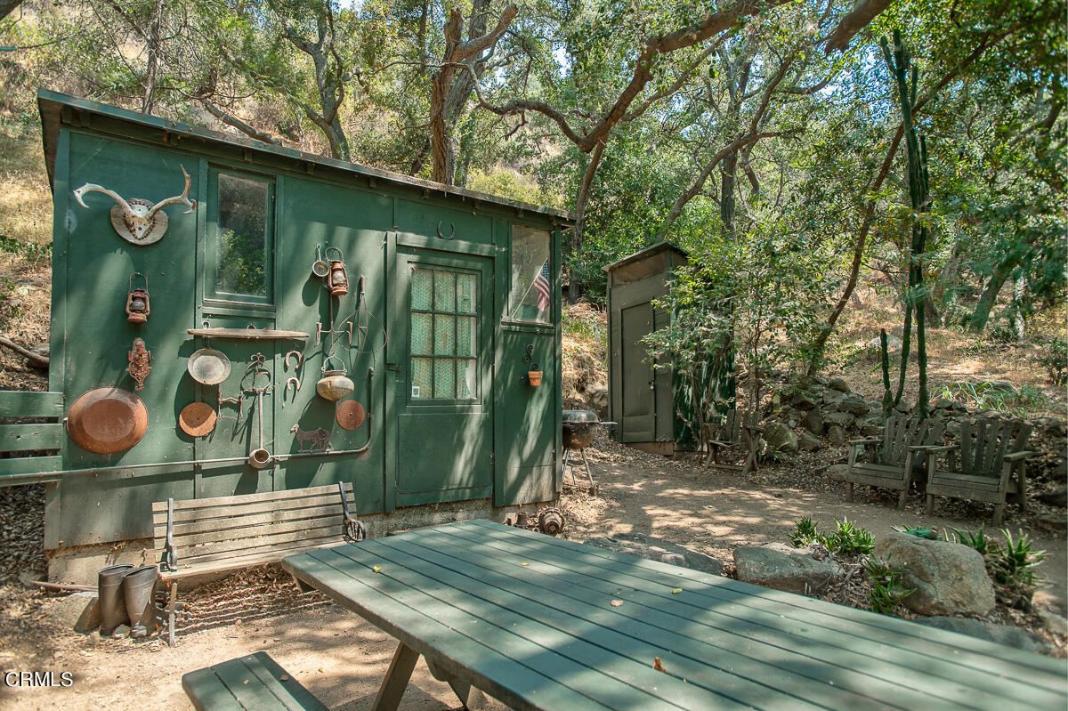 Undisclosed Address Altadena, CA 91001 - Photo 18 of 23 a backyard of a house with seating space and trees