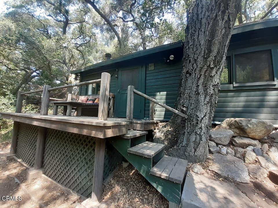Undisclosed Address Altadena, CA 91001 - Photo 2 of 23 a view of backyard of house with wooden deck and outdoor seating