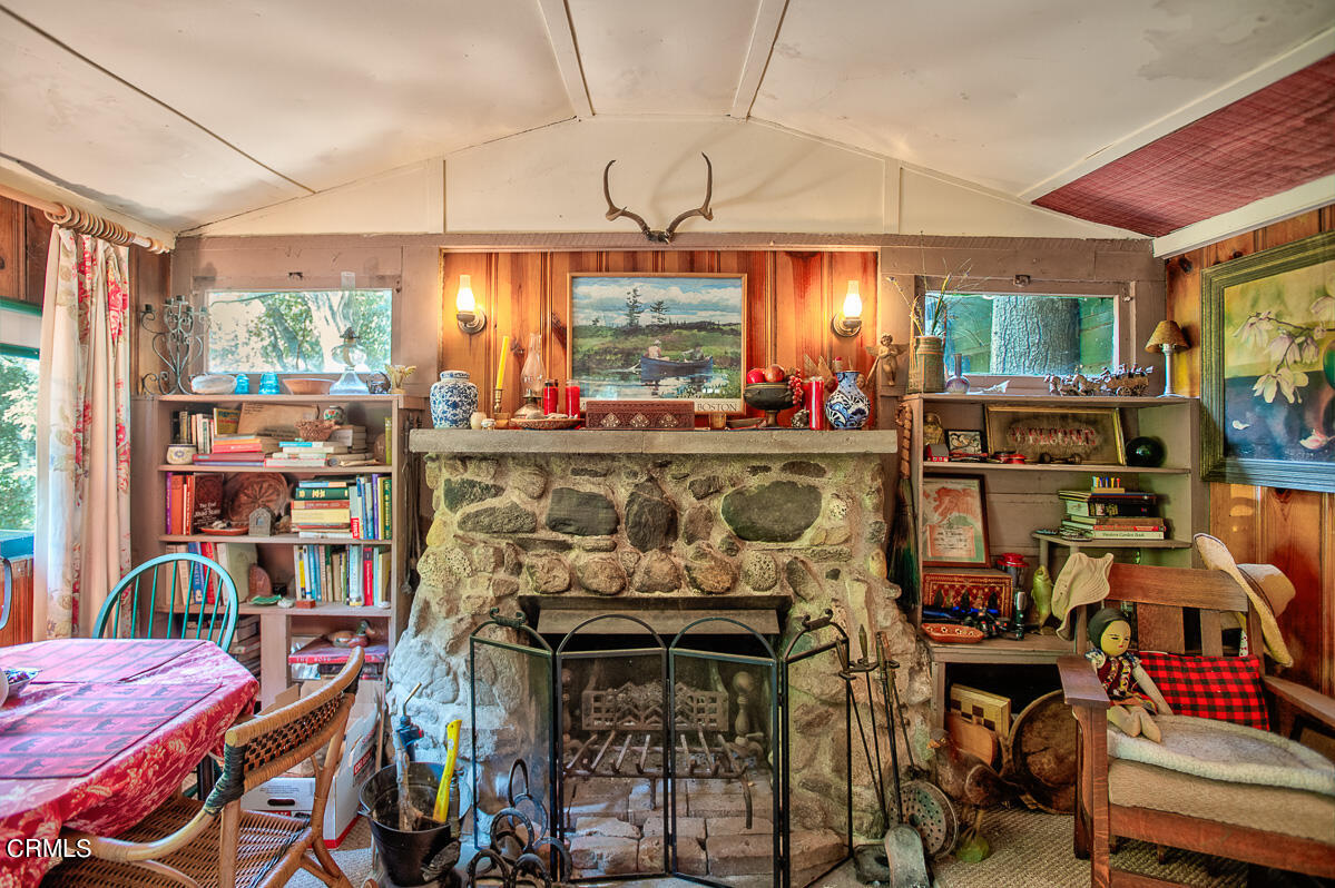 Undisclosed Address Altadena, CA 91001 - Photo 5 of 23 a room filled with furniture and a book shelf