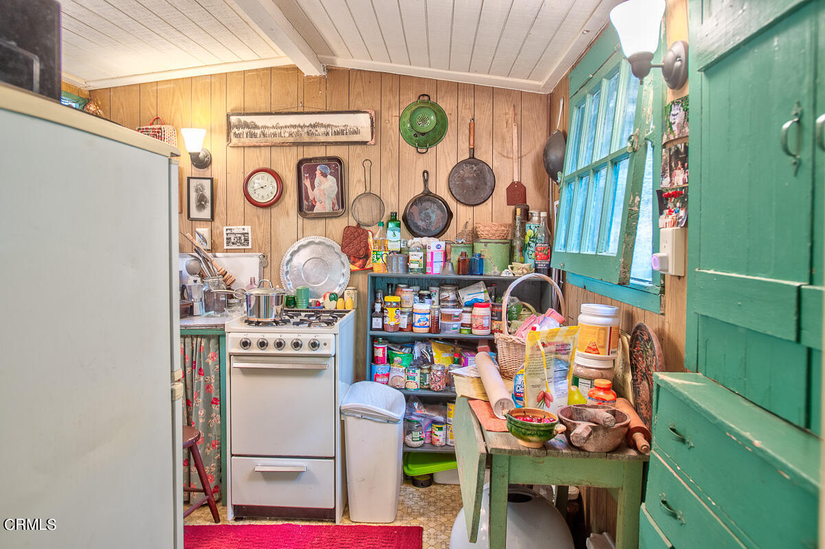 Undisclosed Address Altadena, CA 91001 - Photo 10 of 23 a front view of a kitchen with stainless steel appliances and dining table