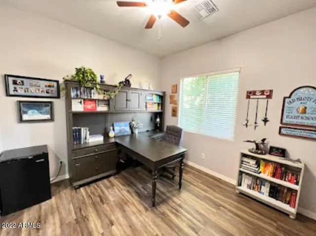 a bed room with a bed and a television