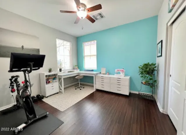 a view of a patio with table and chairs