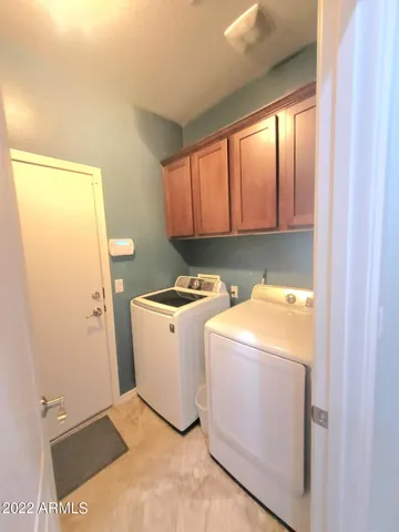a view of a house with a backyard porch and sitting area