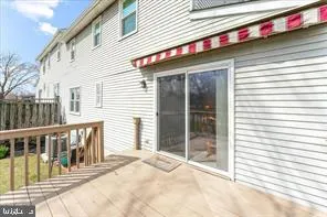 a view of a house with a porch and a floor to ceiling window