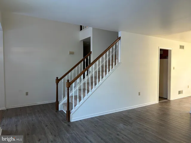 a view of an entryway with wooden floor
