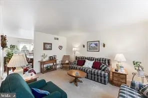 a living room with furniture and a couch