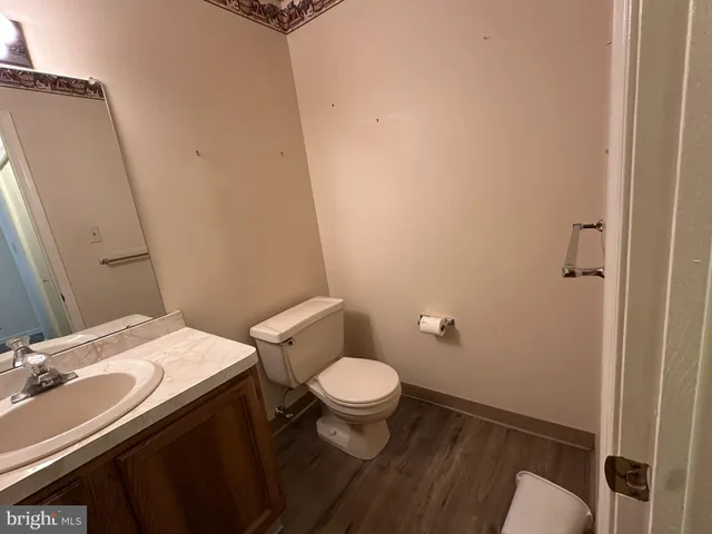 a white toilet sitting next to a bathroom sink