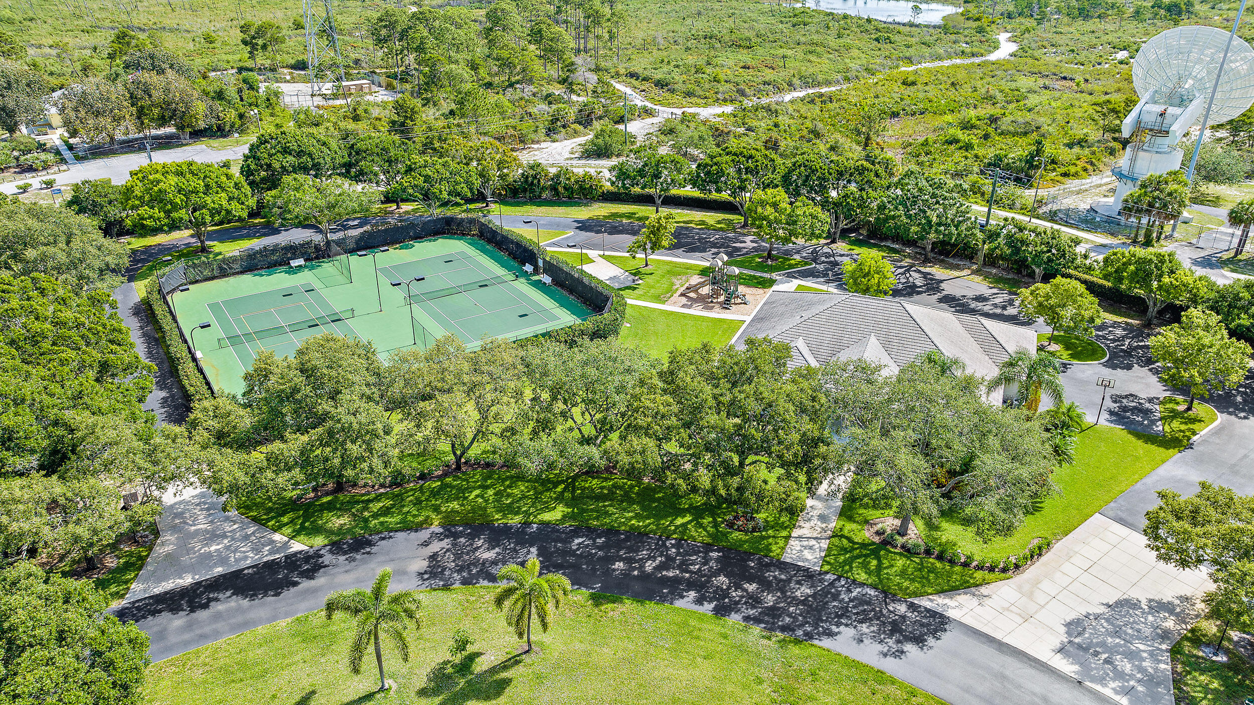18791 Southeast River Ridge Road Jupiter, FL 33469 - Photo 14 of 25 an aerial view of a house with a yard and trees all around