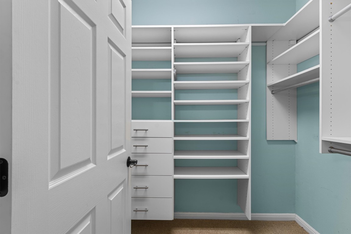409 Rio Grande Loop Georgetown, TX 78633 - Photo 11 of 38 a view of walk in closet with empty racks