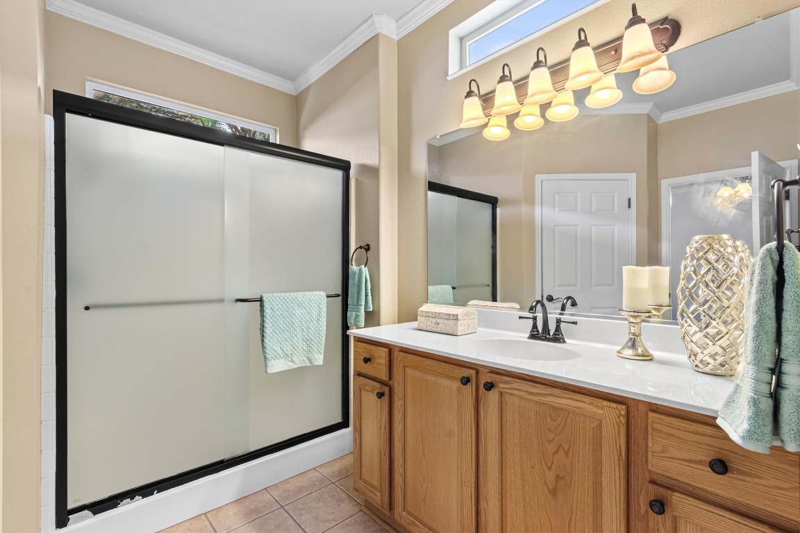 409 Rio Grande Loop Georgetown, TX 78633 - Photo 12 of 38 a bathroom with a double vanity sink and mirror