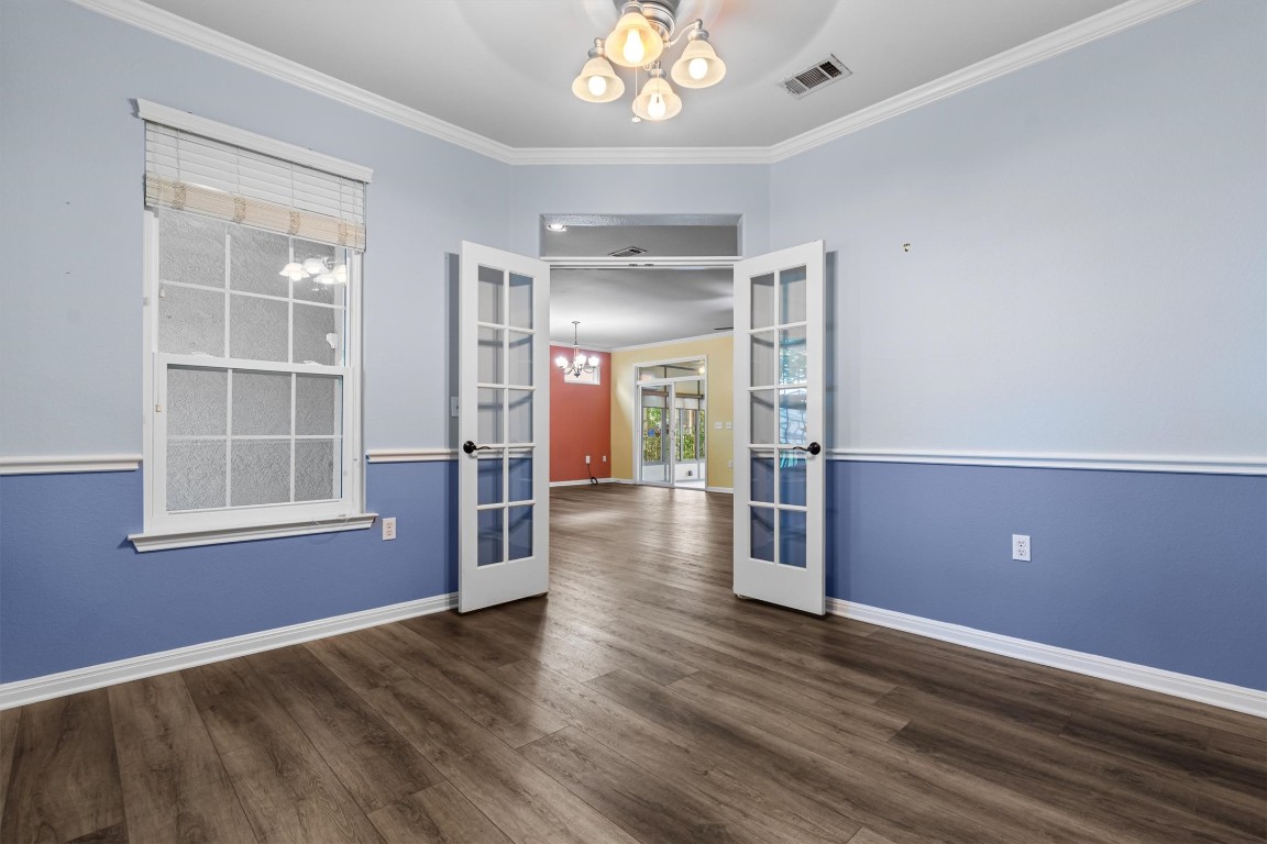 409 Rio Grande Loop Georgetown, TX 78633 - Photo 17 of 38 an empty room with wooden floor and windows