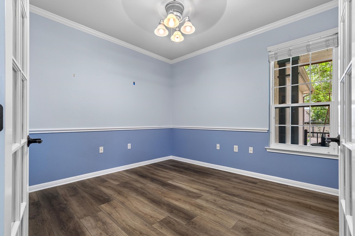 409 Rio Grande Loop Georgetown, TX 78633 - Photo 18 of 38 wooden floor and window in an empty room