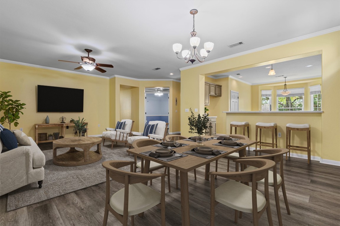 409 Rio Grande Loop Georgetown, TX 78633 - Photo 2 of 38 a view of a dining room with furniture wooden floor and chandelier