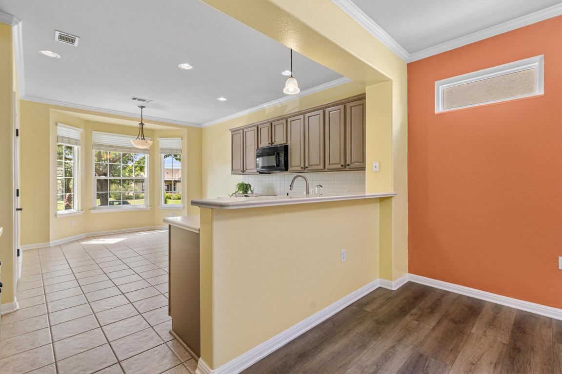 409 Rio Grande Loop Georgetown, TX 78633 - Photo 25 of 38 a view of kitchen with granite countertop cabinets and outdoor space