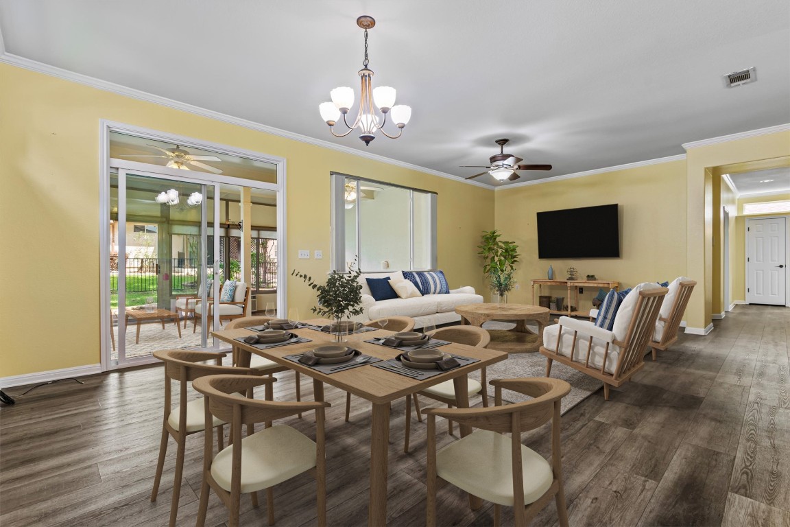 409 Rio Grande Loop Georgetown, TX 78633 - Photo 3 of 38 a view of a dining room with furniture window and wooden floor
