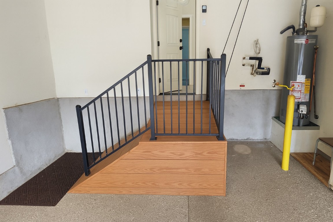 409 Rio Grande Loop Georgetown, TX 78633 - Photo 7 of 38 a view of staircase with lots of frames on wall and wooden floor