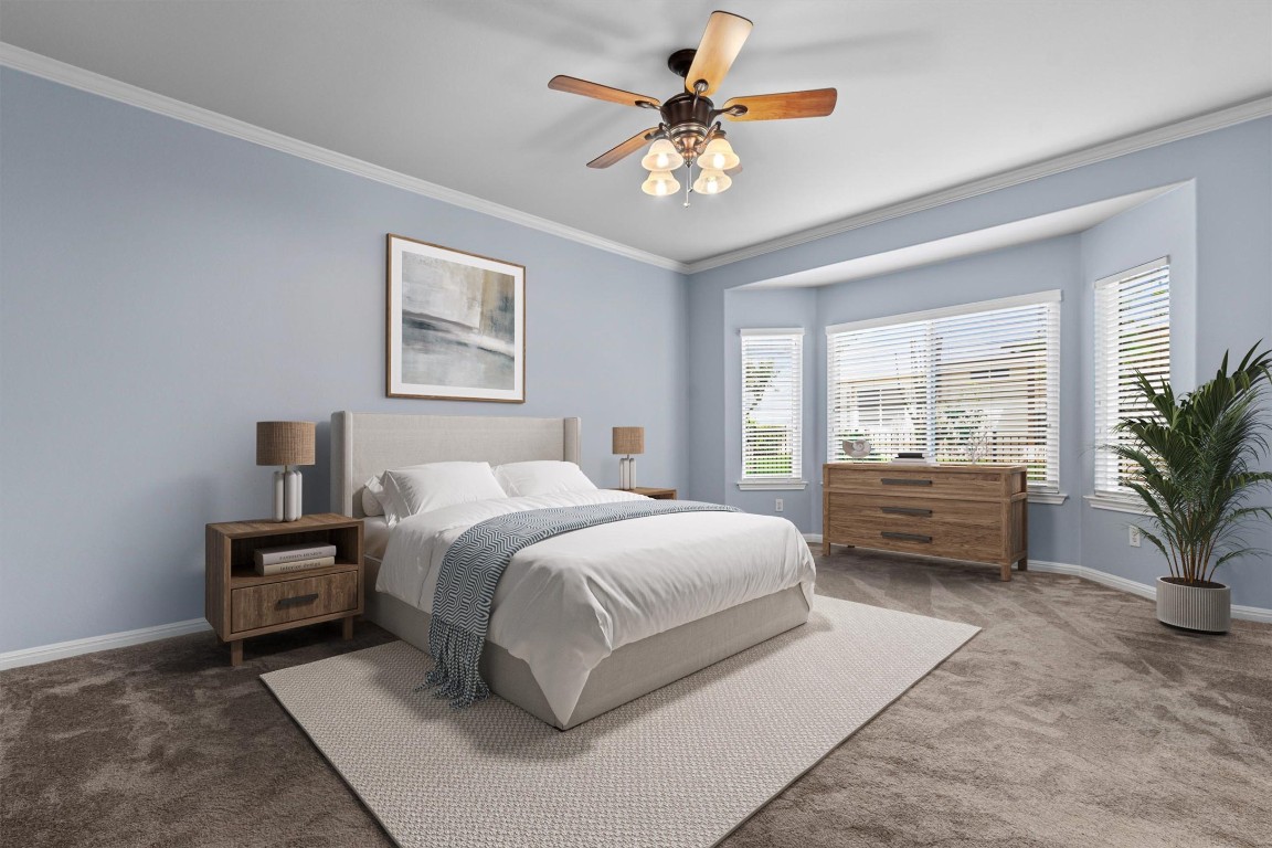 409 Rio Grande Loop Georgetown, TX 78633 - Photo 9 of 38 a spacious bedroom with a bed a couch and a potted plant