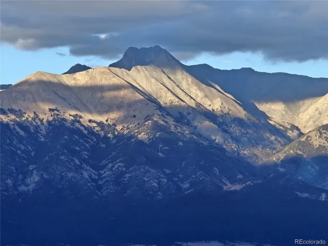 a view of a house with a mountain