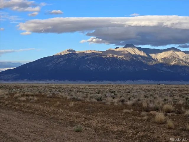 a view of an ocean with a mountain