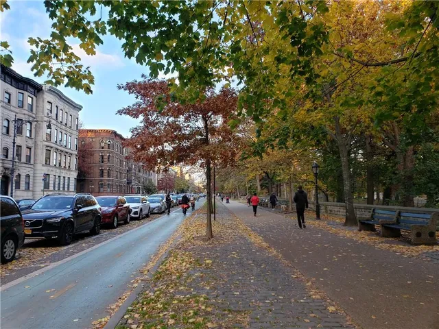 a view of a street with cars