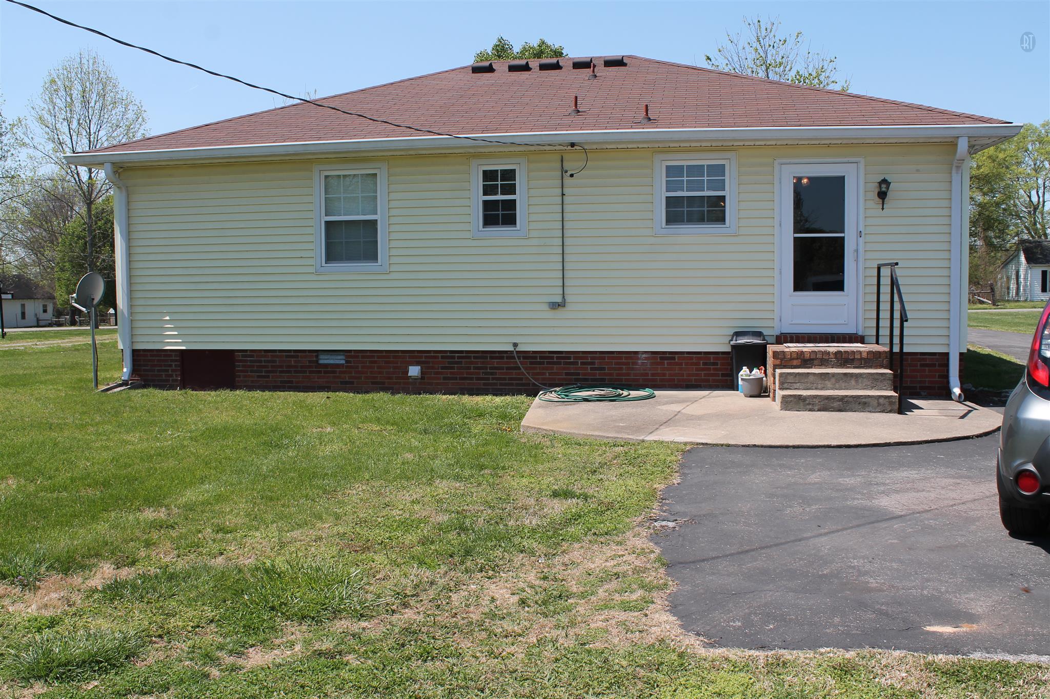 1393 Rutledge Ln. Lebanon, TN 37087 - Photo 3 of 17 Rear of home, nice patio area. Driveway is paved.