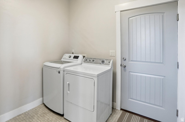 1009 High Creek Road Cove, UT 84320 - Photo 63 of 79 ADU Laundry area featuring light flooring and washer and clothes dryer