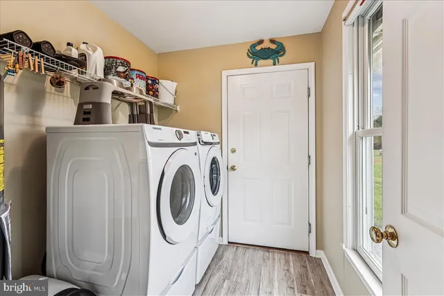 a bathroom with a toilet sink and shower curtain