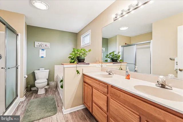 a view of walk in closet with clothes