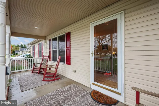 a view of a two chairs in the balcony