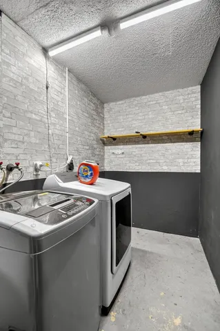 a utility room with washer and dryer