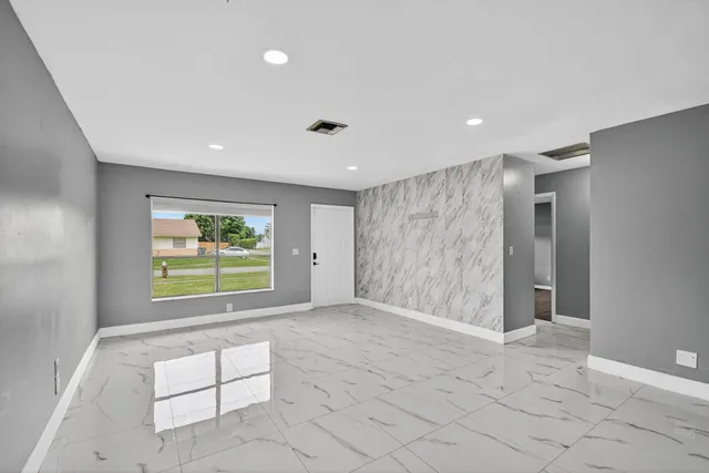 a view of an empty room with a window