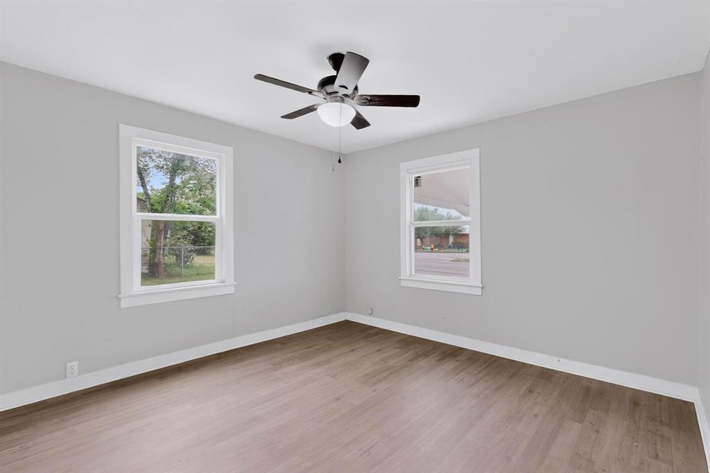 313 Farm To Market 316 Eustace, TX 75124 - Photo 21 of 33 a view of an empty room with wooden floor and a window