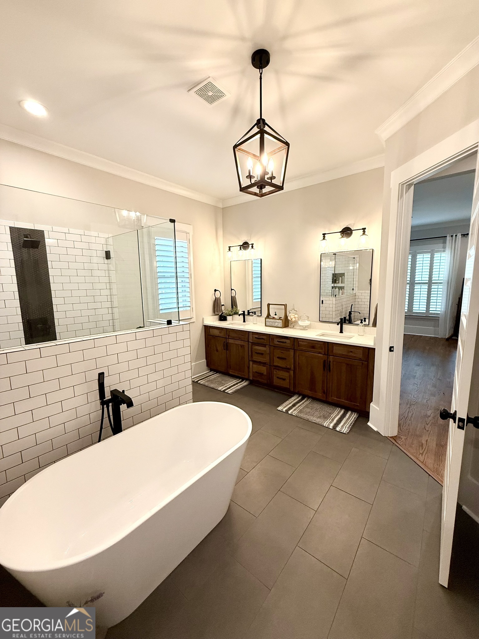 120 Spring Creek Drive Rutledge, GA 30663 - Photo 22 of 38 a bathroom with a tub sink and mirror