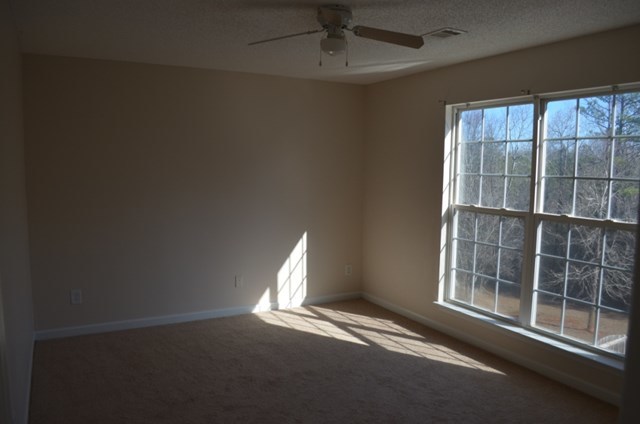 199 Orchard Ridge Drive Forsyth, GA 31029 - Photo 11 of 21 an empty room with windows