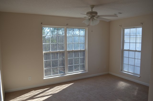 199 Orchard Ridge Drive Forsyth, GA 31029 - Photo 13 of 21 an empty room with windows and fan
