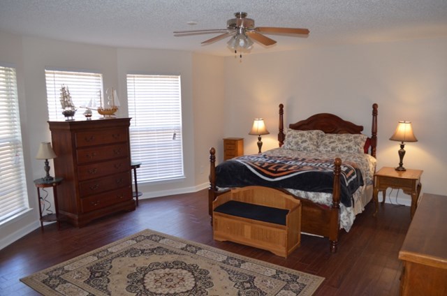 199 Orchard Ridge Drive Forsyth, GA 31029 - Photo 7 of 21 a bedroom with a bed and wooden floor