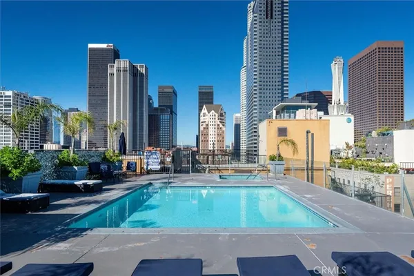 a view of swimming pool with outdoor seating