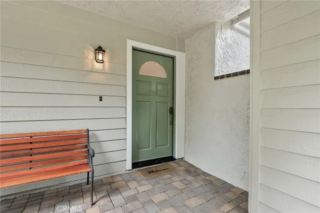 a view of a small room with stairs and a window
