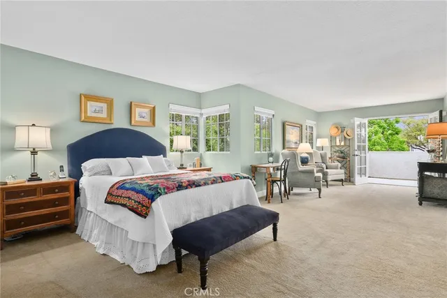 a spacious bedroom with a bed and a couch