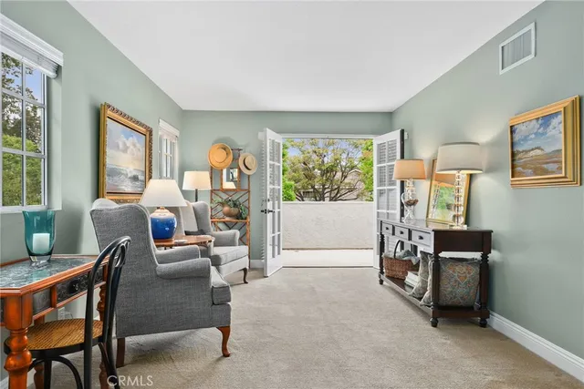 a bedroom with a bed and lamp