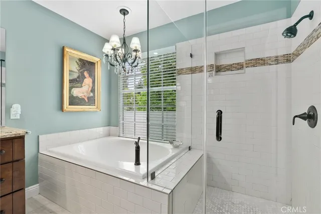 a view of a patio with table and chairs potted plants with wooden floor and fence