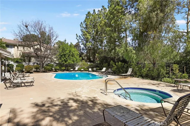 an aerial view of a house with a yard and garden