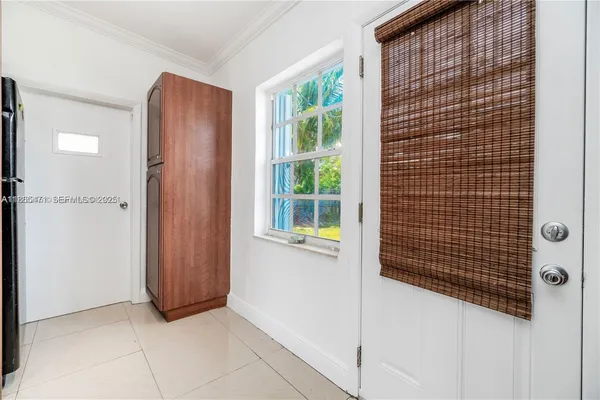 a kitchen with stainless steel appliances granite countertop a stove a microwave and a refrigerator