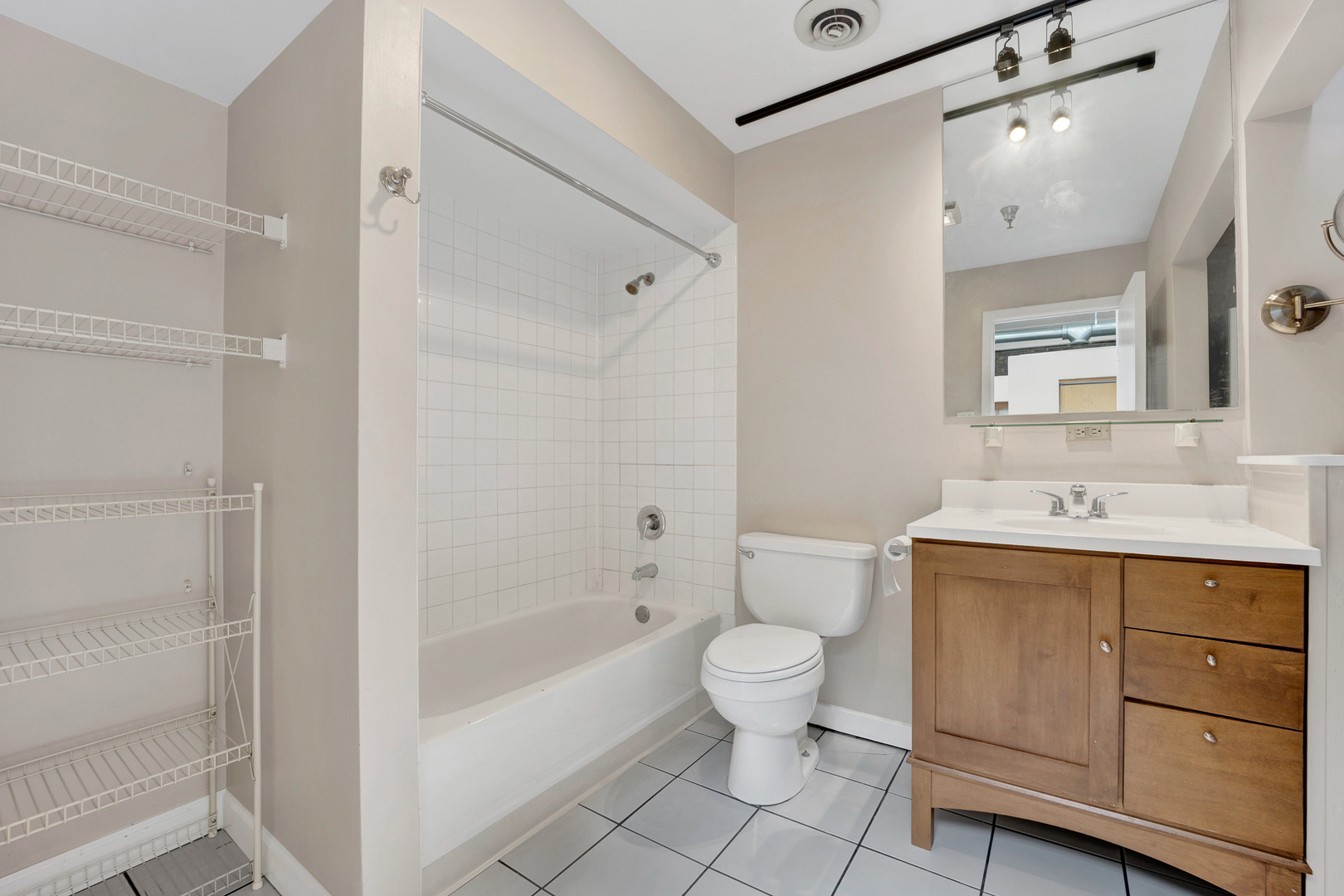 1617 South Michigan Avenue, Unit 202 Chicago, IL 60616 - Photo 12 of 14 a bathroom with a sink toilet and shower