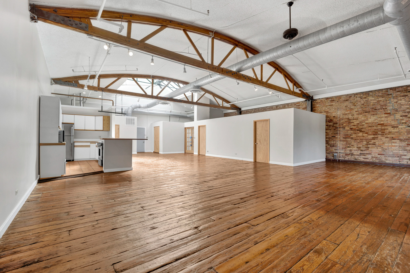 1617 South Michigan Avenue, Unit 202 Chicago, IL 60616 - Photo 3 of 14 a view of a water heater room with wooden floor