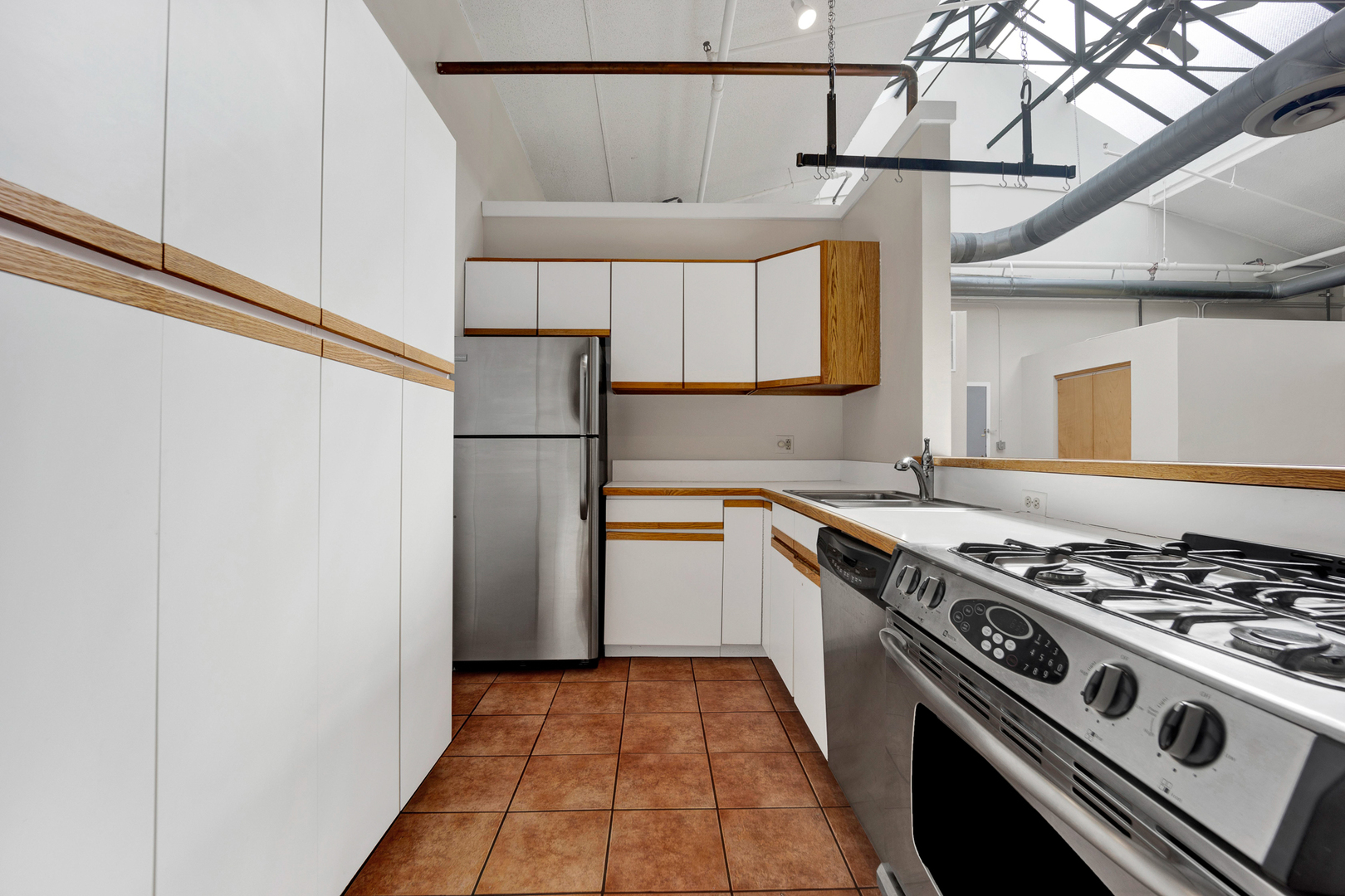 1617 South Michigan Avenue, Unit 202 Chicago, IL 60616 - Photo 8 of 14 a kitchen with a stove and a refrigerator