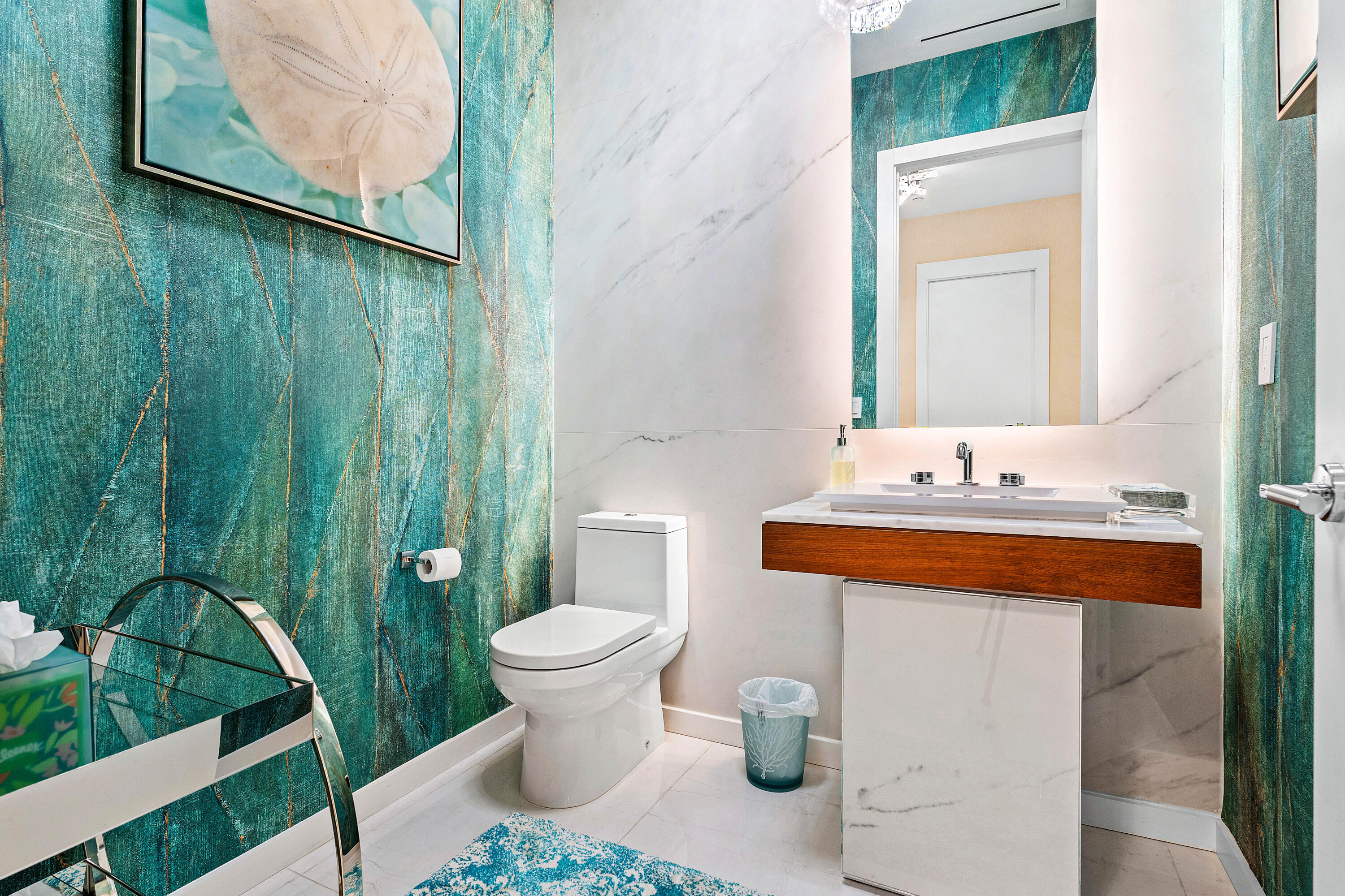 200 Southeast Mizner Boulevard, Unit 104 Boca Raton, FL 33432 - Photo 12 of 82 a bathroom with a sink and a mirror